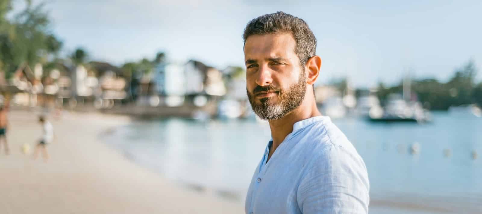 man standing on beach during daytime